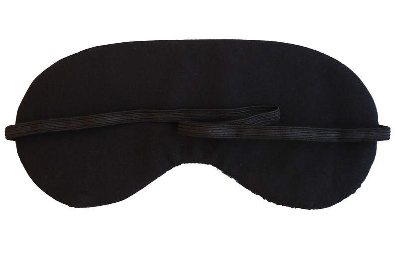 May include: Black sleep mask with an elastic strap.