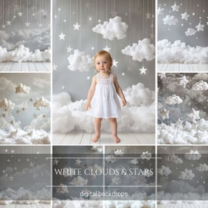 May include: A little girl in a white dress stands in front of a backdrop with white clouds, stars, and a gray sky. The text "WHITE CLOUDS & STARS" and "digital backdrops" is displayed at the bottom of the image.