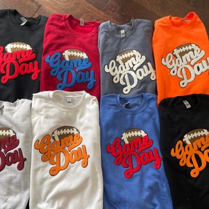 Felpa con toppa in ciniglia per il giorno della partita: girocollo da football