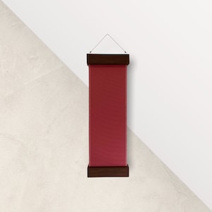May include: A red banner hanging from a wooden frame. The banner is blank and ready for text or images.