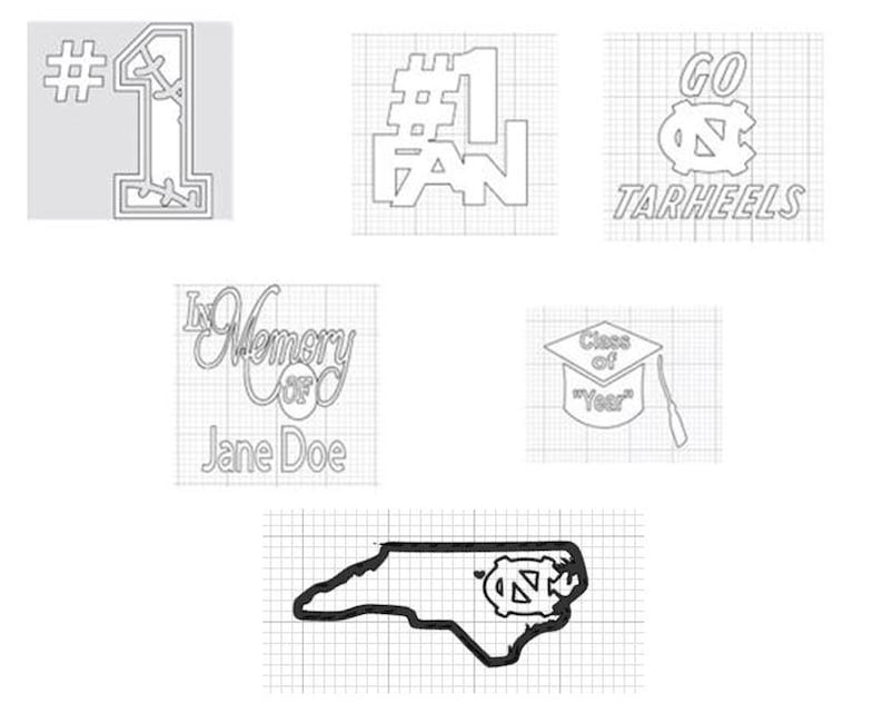 May include: A collection of outline designs, including "#1", "#1 FAN", "GO TARHEELS", "In Memory of Jane Doe", a graduation cap with "Class of Year", and the outline of North Carolina with a logo.