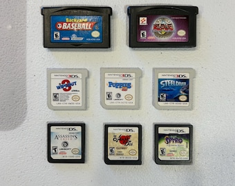 Various Nintendo 3DS games: Steel Diver, Wipeout 3, Puppies 3D