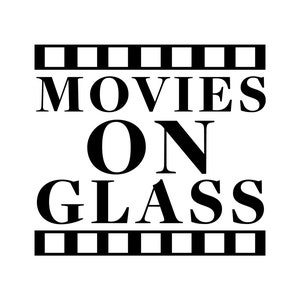 May include: Black and white graphic design with a film strip border. The text reads "MOVIES ON GLASS".