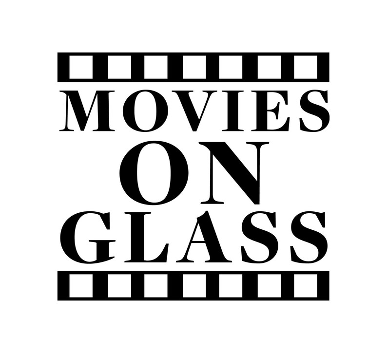 May include: Black and white graphic design with a film strip border. The text reads "MOVIES ON GLASS".