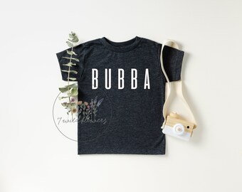 May include: A dark grey t-shirt with the word "BUBBA" printed in white on the front.