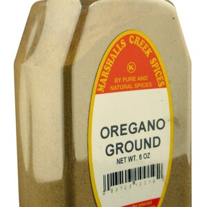 May include: A clear plastic container of ground oregano. The label reads "OREGANO GROUND NET WT. 6 OZ." The container has a red cap with the words "SEALED FOR YOUR PROTECTION". The brand name is Marshalls Creek Spices.