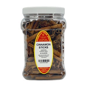 May include: A clear plastic jar filled with brown cinnamon sticks, topped with a white lid. The yellow oval label reads Marshalls Creek Spices, Cinnamon Sticks, 20 Ounces, and includes a barcode, ingredient list, and company contact information.