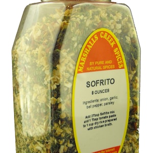 May include: A clear plastic jar filled with a blend of dried herbs and spices. The label reads "Marshalls Creek Spices Sofrito 8 ounces". The ingredients are listed as onion, garlic, bell pepper, and parsley. Instructions for use are included on the label.