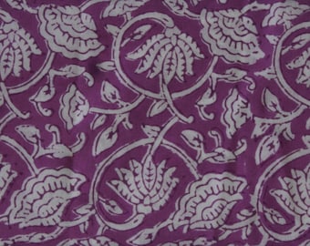 May include: Purple fabric with a white floral pattern. The pattern features stylized flowers and leaves.