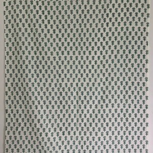 May include: White fabric with a repeating pattern of small green stylised trees. The fabric is folded in half.