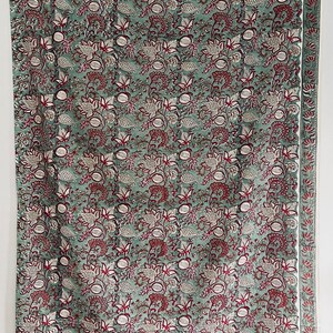 Red & green cotton straight pants with all-over small flower hand block print.