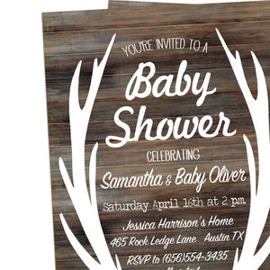 May include: A rustic woodgrain background with white antlers framing the text "You're invited to a Baby Shower celebrating Samantha & Baby Oliver. Saturday April 16th at 2 pm. Jessica Harrison's Home 465 Rock Ledge Lane Austin TX RSVP to (656)554-3435"