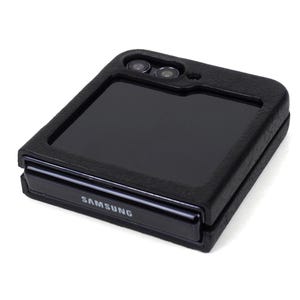 May include: A black Samsung phone case with a built-in screen protector. The case has a textured surface and a flap that covers the screen.