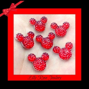 May include: Six red rhinestone Mickey Mouse head embellishments.