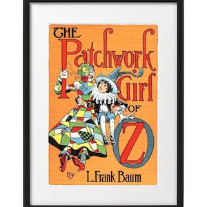 May include: A vintage book cover illustration for "The Patchwork Girl of Oz" by L. Frank Baum. The cover features a colorful patchwork girl and a whimsical character holding a large letter "Z" on an orange background.