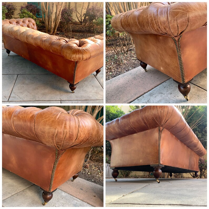 May include: A brown leather tufted sofa with wooden legs and brass casters. The sofa is shown from multiple angles, including the back, side, and bottom.