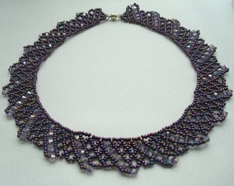 Dark purple necklace of beads and Swarovski crystals