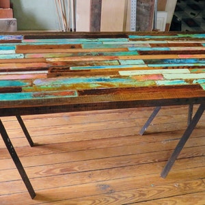 Colorful wood mosaic coffee table distressed and rustic barn wood.