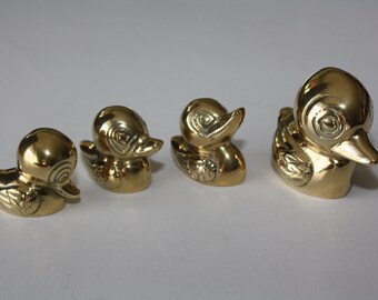 Cute little copper duck family of four.
