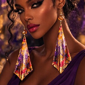 May include: Dramatic, close-up portrait featuring a woman wearing large, colorful earrings. The earrings have a gold frame and a triangular shape with a floral pattern in shades of purple, pink, and yellow. The woman is wearing a purple dress.