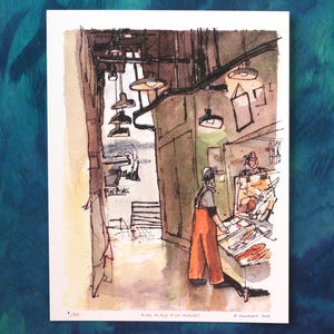 May include: Watercolor painting of Pike Place Fish Market. The artwork depicts a fishmonger in orange overalls and a white hat, standing behind a counter with fish. The scene is set in a dimly lit market with hanging lights and a doorway.