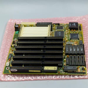 May include: A green circuit board with multiple black connectors, a white chip, and the text "N9308-25646".