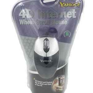 May include: A Yahoo! branded 4D Internet Wheel Scroll Mouse in original blister packaging. The mouse is silver and black with a central scroll wheel. The packaging features the text 4D Internet Wheel Scroll Mouse and The Easiest and Coolest Way To Point and Click on Your PC.