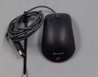 May include: A black wired computer mouse with a gray cord and a USB connector. The mouse has a red optical sensor and the word "Microsoft" printed on the top.