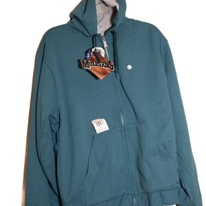 May include: A teal blue zip-up hooded sweatshirt with a white tag that says "MuleSkinner" on it.