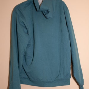 May include: A teal blue hooded sweatshirt with a drawstring hood.