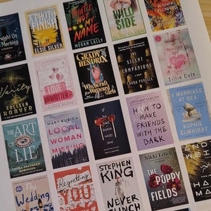 May include: A collection of book covers, featuring titles like "Verity," "Wild Side," and "The Poppy Fields." The covers display various designs, including illustrations and text, with authors' names prominently displayed. The books are arranged on a white surface.