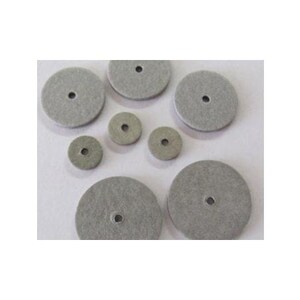May include: A set of eight gray felt polishing wheels of various sizes. The wheels have a central hole for attachment to a polishing tool.