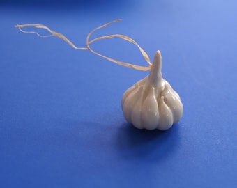 White Garlic porcelain sculpture. Ceramic figurine artwork for good luck. A gift amulet for your loved ones. Funny handmade kitchen decor.