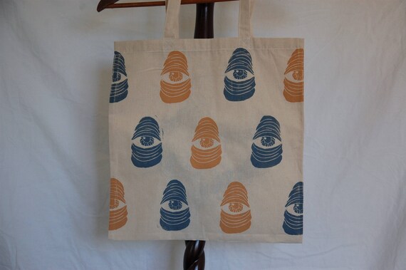 Canvas Tote Bag With Original "Here's Lookin'" Block Print Pattern in Blue & Yellow Ink on One Side // "Caring" Screen Print Design Option