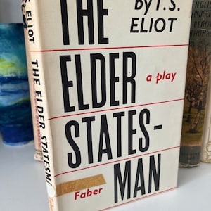 May include: A vintage paperback book titled "The Elder Statesman" by T.S. Eliot. The book cover is white with black text and a red stripe. The book is a play.
