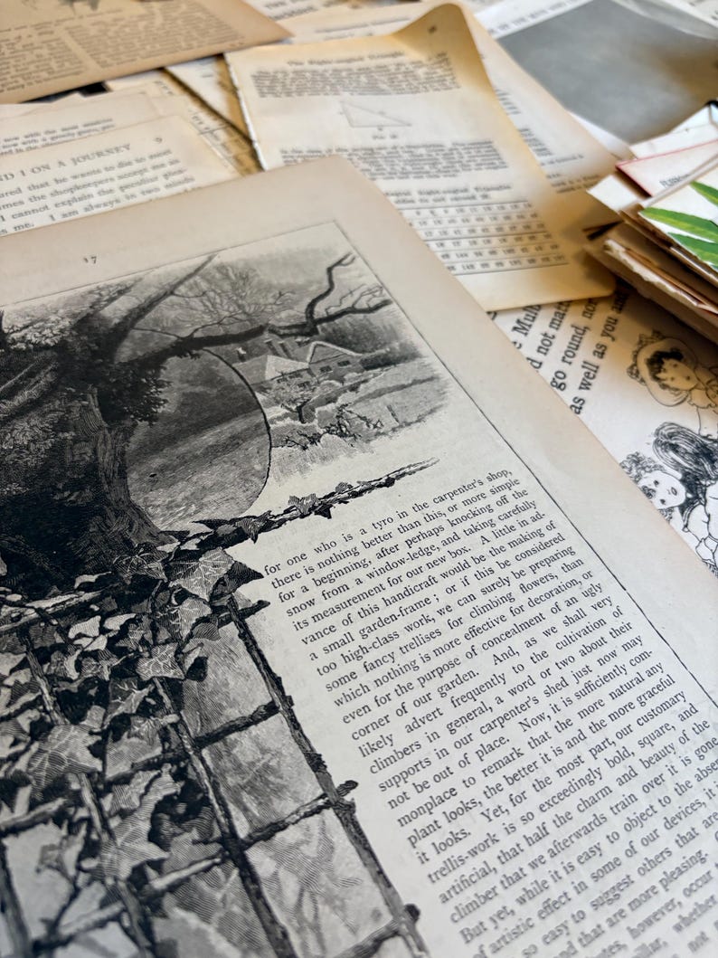 Bundle of over 100 vintage and antique paper ephemera pieces, including aged letters, postcards, and documents, arranged in a flat lay on a rustic wooden surface ready for scrapbooking and paper craft projects