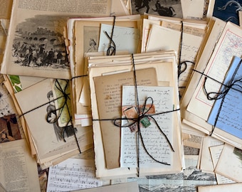 May include: A collection of vintage papers and ephemera, including a newspaper titled "Illustrated Times", handwritten letters, and botanical illustrations. The papers are tied together with twine and are in various shades of brown, cream, and white.