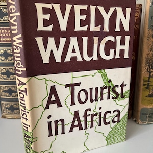Evelyn Waugh A tourist in Africa 1st edition hardback book with original dust jacket beautiful condition unclipped 1st edition vintage book