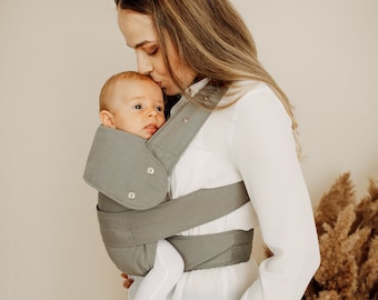 Marsupi Breeze - Un porte-bébé pas comme les autres. Mélange de lin/coton doux, léger et respirant. L'avant, les côtés et l'arrière permettent de porter votre bébé.