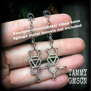 These awesome earrings feature a pair of antique silver MDMA molecules, measuring just under 5cms from tip to tip, weighing only a gram or two each.