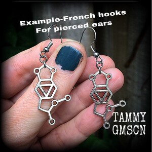 These awesome earrings feature a pair of antique silver MDMA molecules, measuring just under 5cms from tip to tip, weighing only a gram or two each.

This pair have been made with stainless steel french hooks, for pierced ears.
