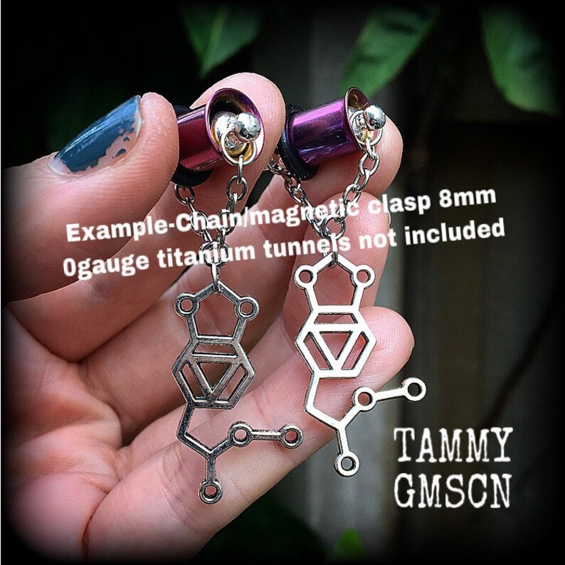 These awesome earrings feature a pair of antique silver MDMA molecules, measuring just under 5cms from tip to tip, weighing only a gram or two each.
