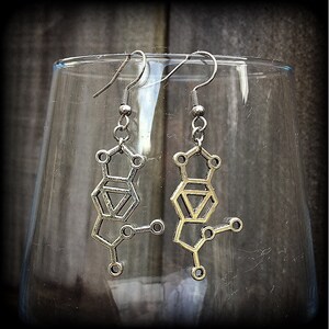 These awesome earrings feature a pair of antique silver MDMA molecules, measuring just under 5cms from tip to tip, weighing only a gram or two each.

This pair have been made with stainless steel french hooks, for pierced ears.