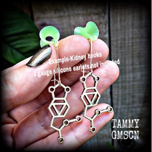 These awesome earrings feature a pair of antique silver MDMA molecules, measuring just under 5cms from tip to tip, weighing only a gram or two each.