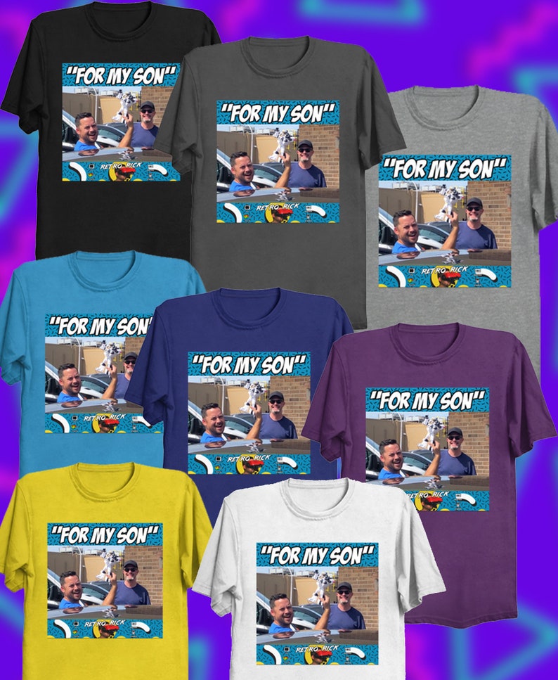 May include: A collection of t-shirts in various colors, including black, gray, blue, and white. Each shirt features a graphic with the text "FOR MY SON" above a photo of two men and a dog. The shirts are casual wear.