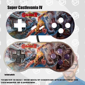May include: Two game controllers with the Super Castlevania IV artwork. The top controller has a white directional pad and buttons, while the bottom controller has a black directional pad and purple buttons. The controllers are connected by a black cable.