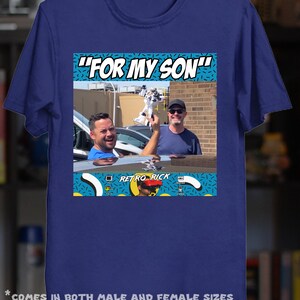 May include: A navy blue t-shirt featuring a graphic with the text "FOR MY SON" above a photo of two men. Below the photo is the text "RETRO RICK". The shirt is a mock-up, and colors may vary.