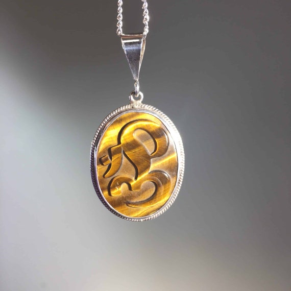 Tiger Eye 'Om' pendant for necklace healing cryst… - image 1