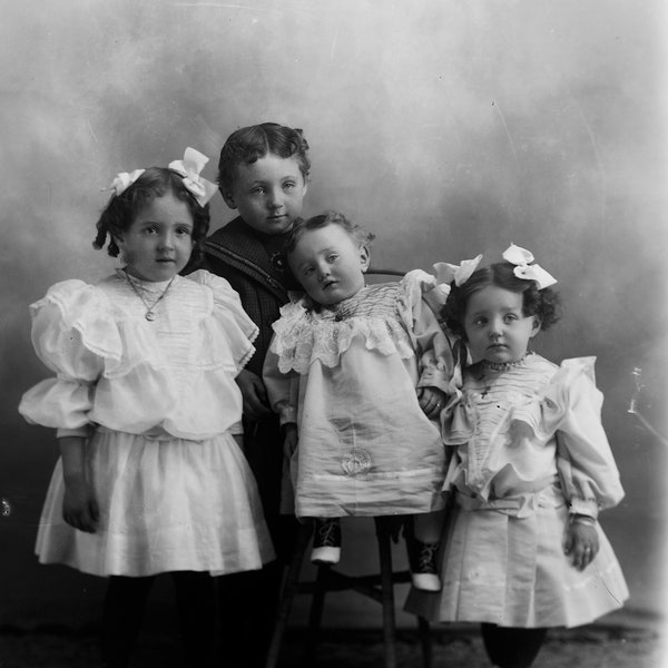 Large glass plate negative featuring a group of four children in Sunday best - circa late-1800s