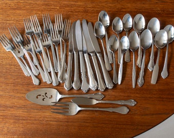 Mismatched stainless flatware set for 6 people plus 3 serving pieces, 33 pieces total